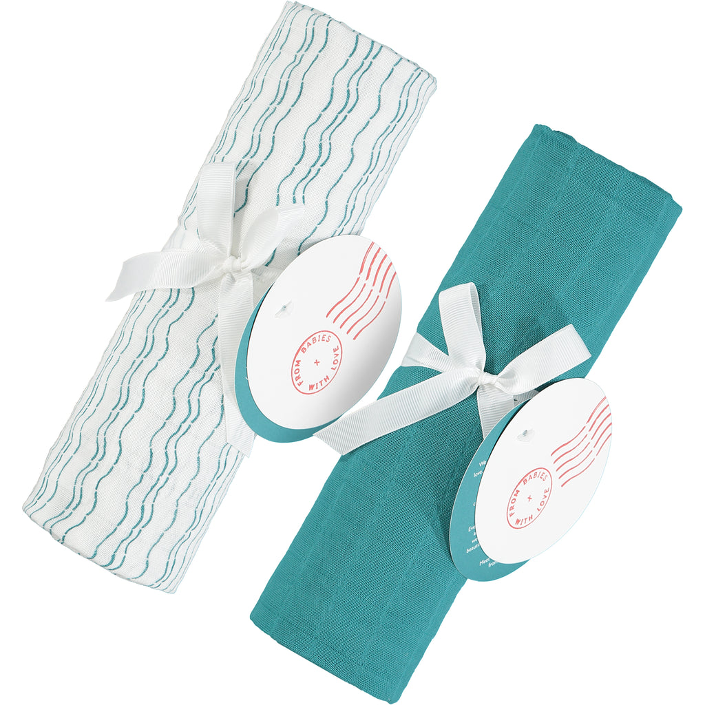 Send love and kindness with our Waves of Joy and teal organic muslin baby shawl + swaddling wraps, a heartfelt and beautiful baby gift. 