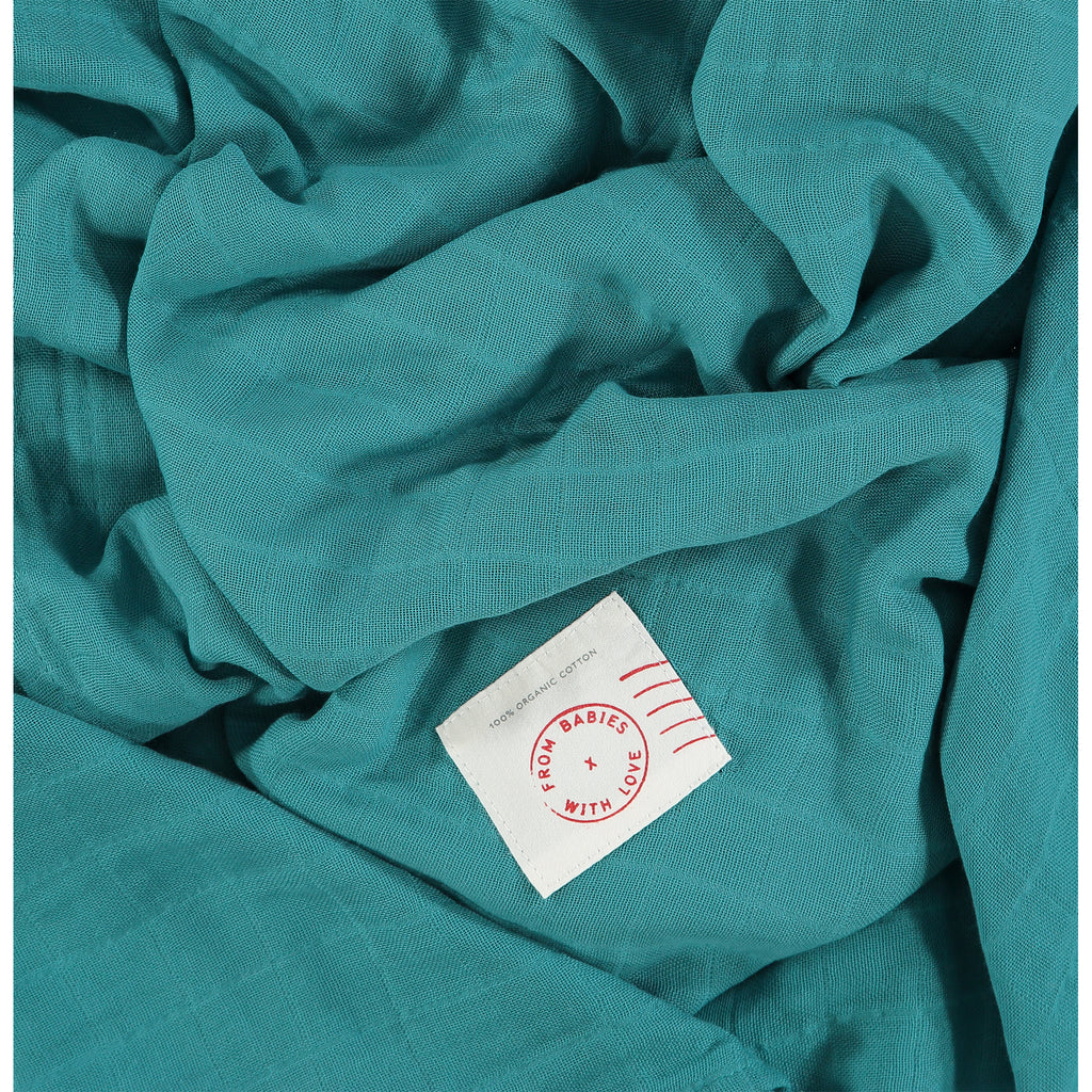Teal - Send love and kindness with our Waves of Joy organic muslin baby shawl + swaddling wrap, a heartfelt and beautiful baby gift. 