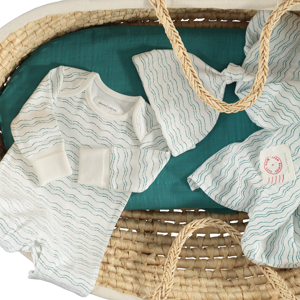 Baby basket - Waves of Joy organic baby gift set - large - Send love and kindness with our Waves of Joy organic baby grow, knot hat, bandana bib and muslin swaddling wrap, a heartfelt and beautiful baby gift.