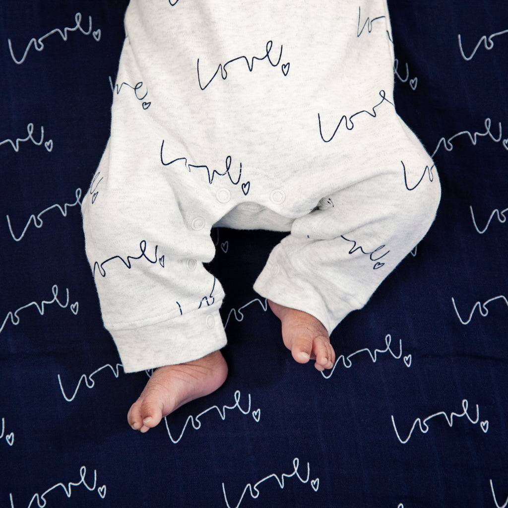 Baby toes - Our love multi-print organic baby grow is made with luxuriously soft organic cotton; give the gift of love!