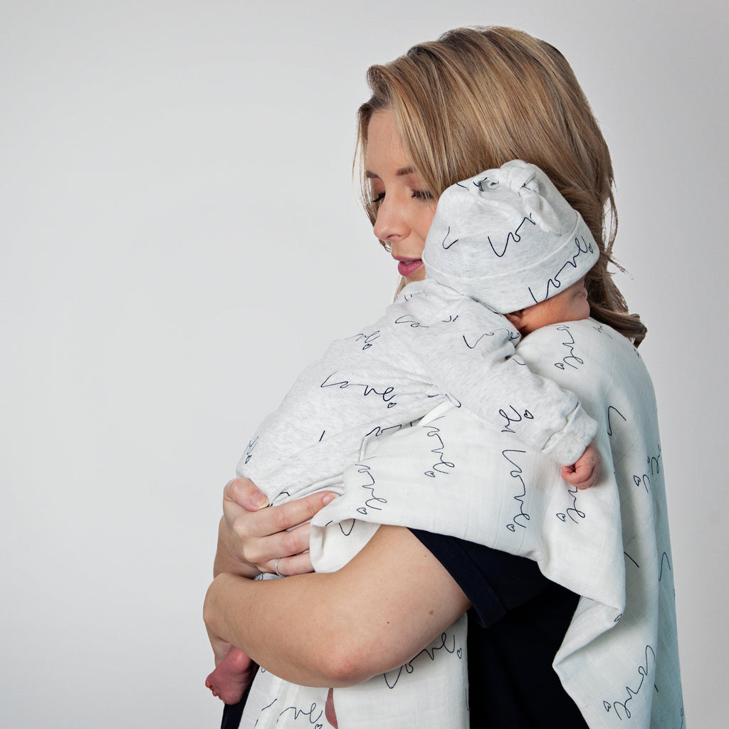 Lifestyle - Our love multi-print organic baby grow is made with luxuriously soft organic cotton; give the gift of love!
